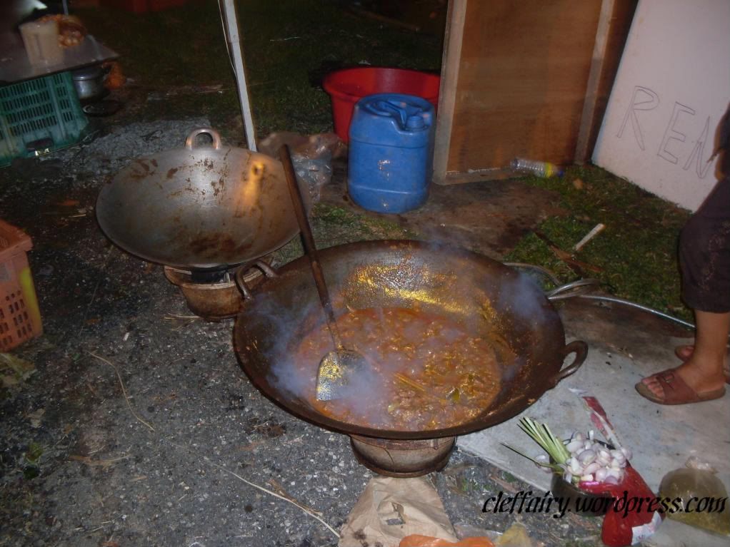 Rendang Rendang, a kind of thick curry meant to be eaten with lemang is being cooked.